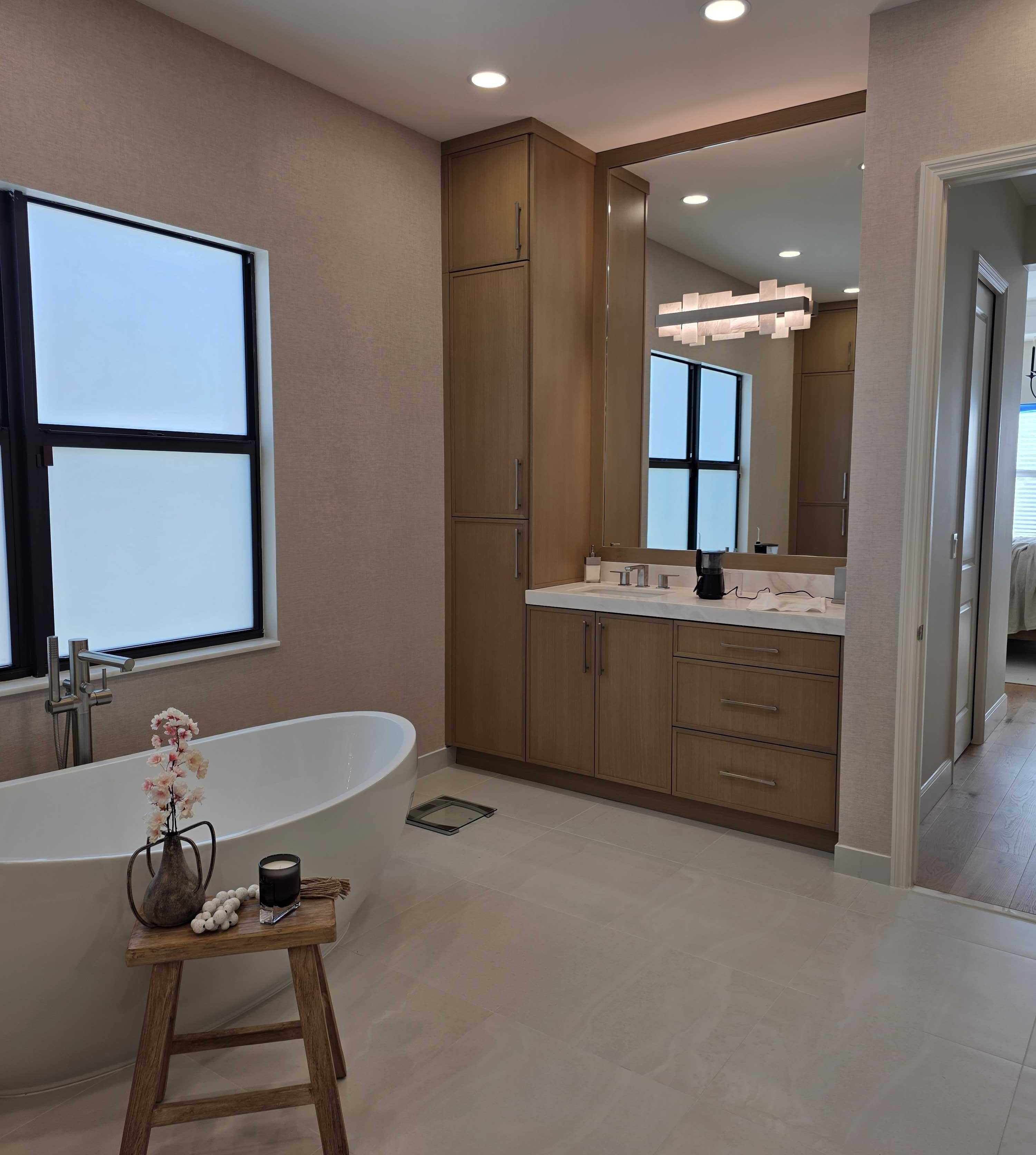 Bathroom with freestanding tub and vanity