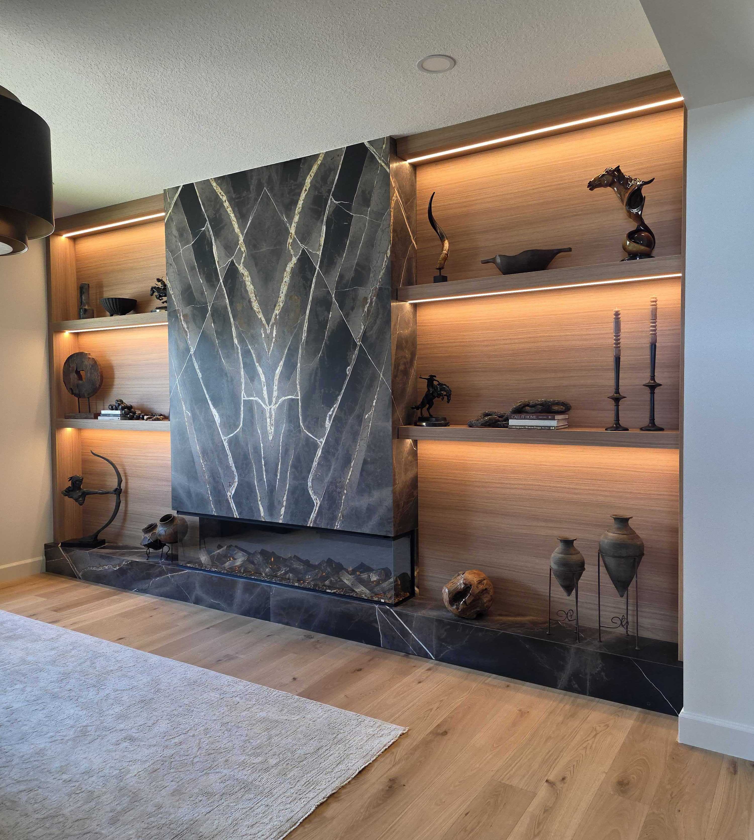 Fireplace wall unit with illuminated shelving